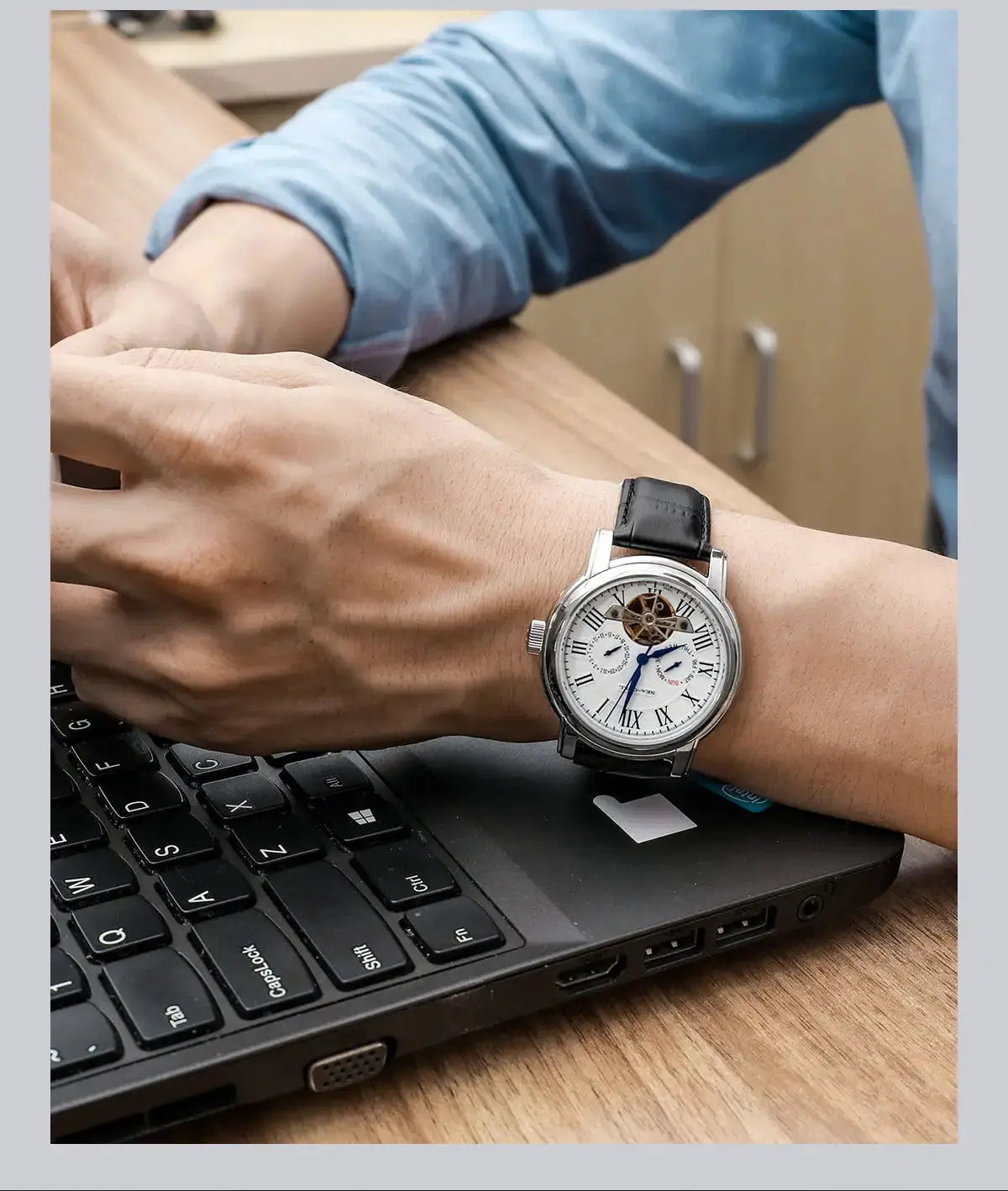 Seagull ST25 skeleton men's automatic wristwatch with silver case and black leather strap