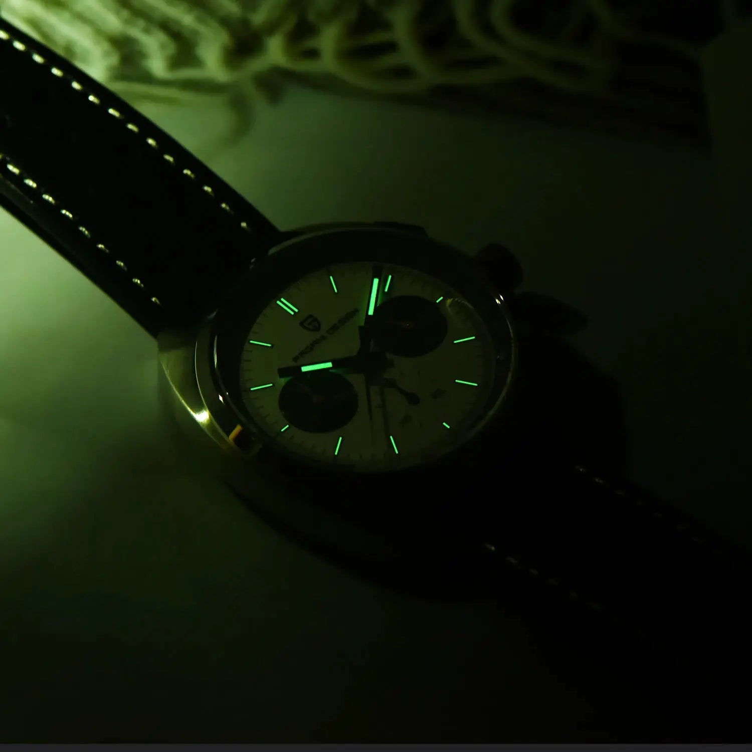 PAGANI DESIGN men's chronograph watch with black leather strap and green luminescent markers.