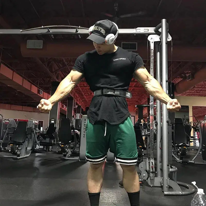 Men's basketball shorts, green mesh quick-dry fabric with white trim for gym workouts