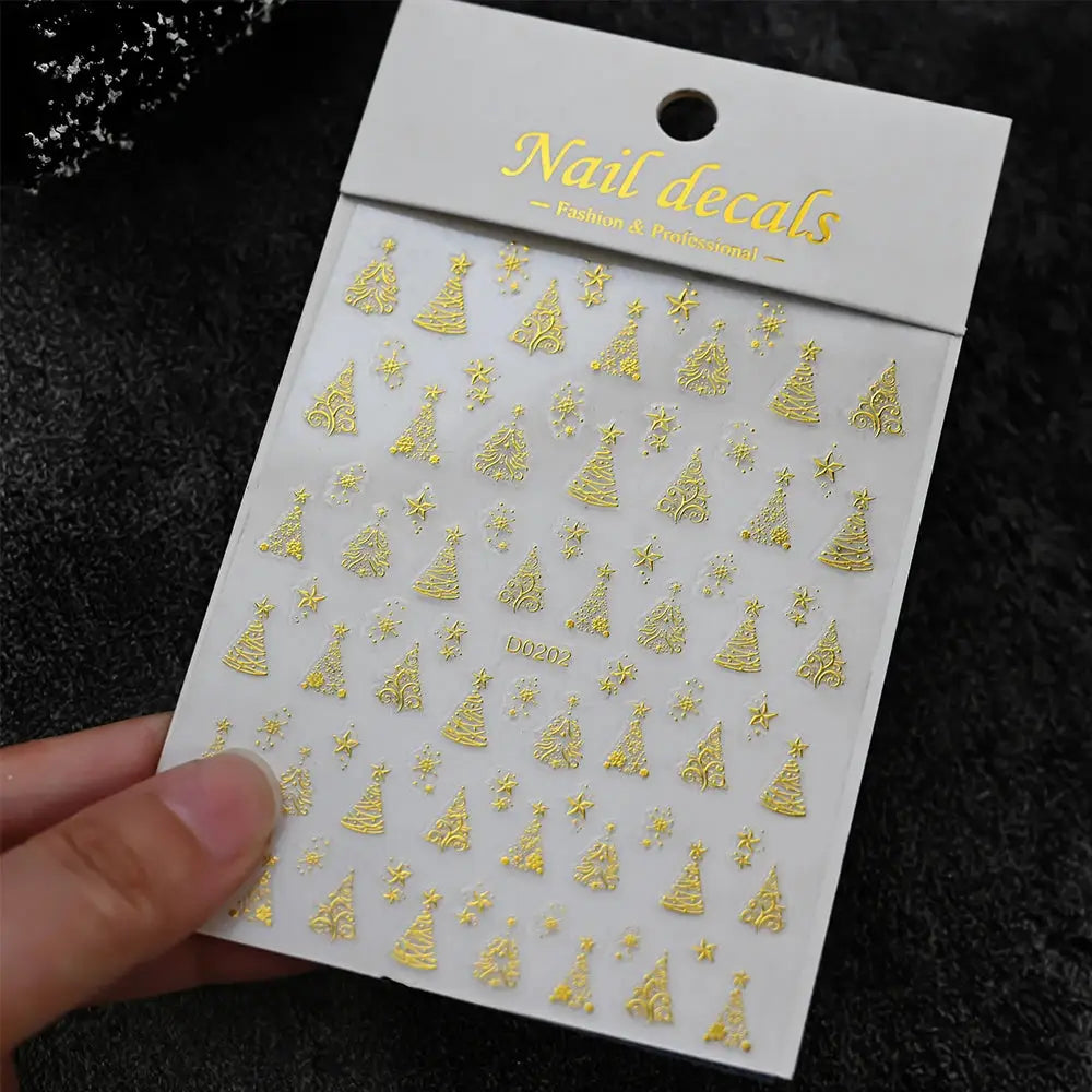 Gold Christmas nail decals sheet with trees, stars and snowflakes for festive self-adhesive nail art