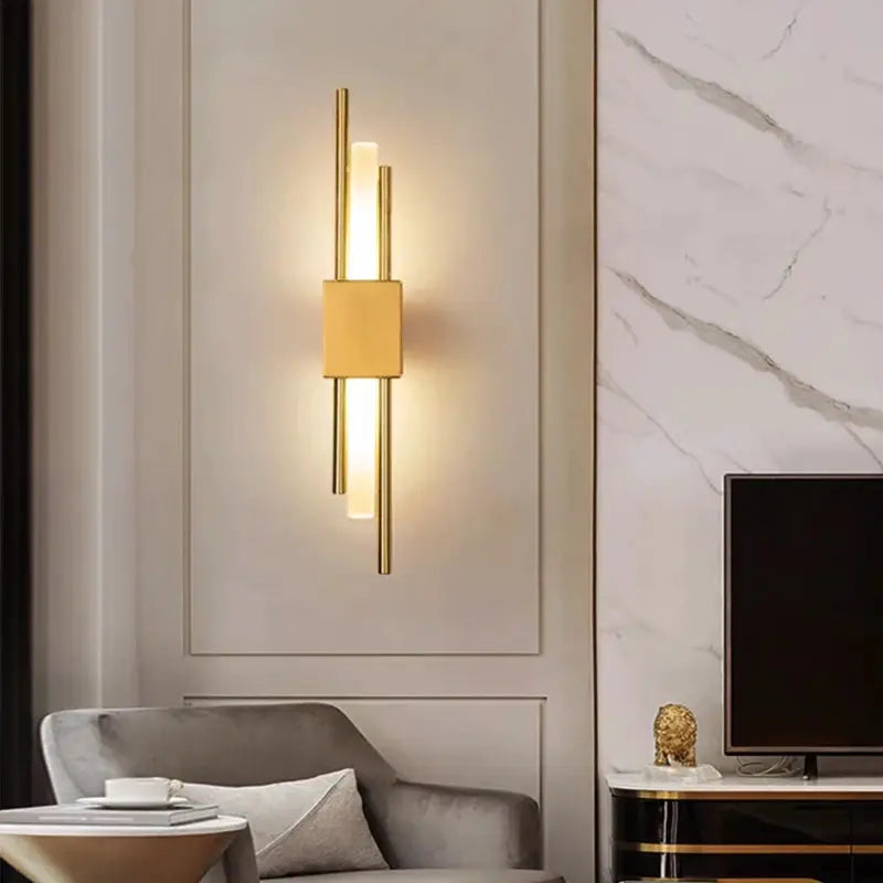 Nordic LED wall lamp with brass finish, vertical bars and central square block, warm ambient light.