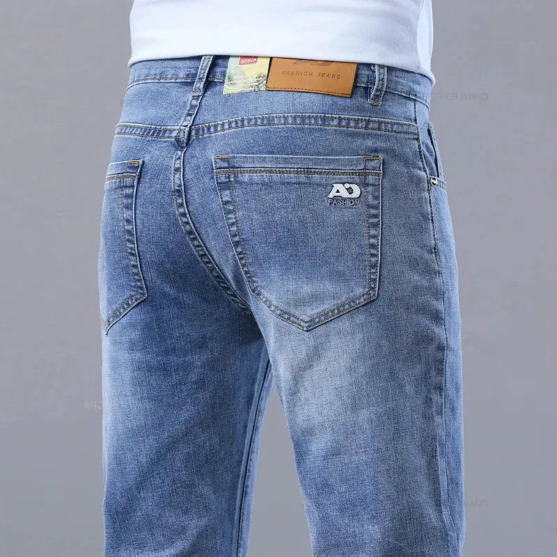 Men's slim light blue stretch denim jeans with back pockets and AD FASHION logo