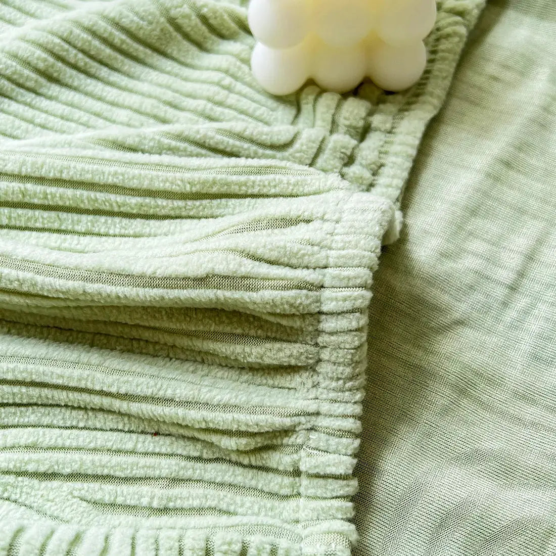 Sofa seat cushion cover in light green with ribbed plush fabric and zipper closure