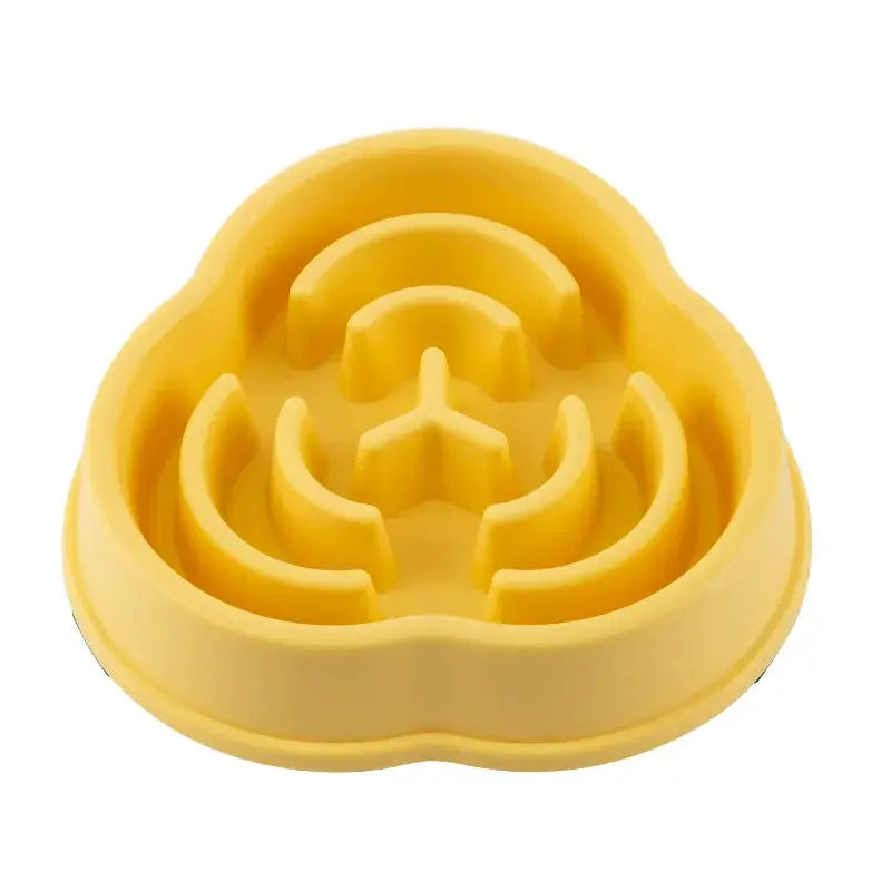 Pet slow-feed bowl by Simples Market, yellow with maze-like inner channels; non-slip anti-choking