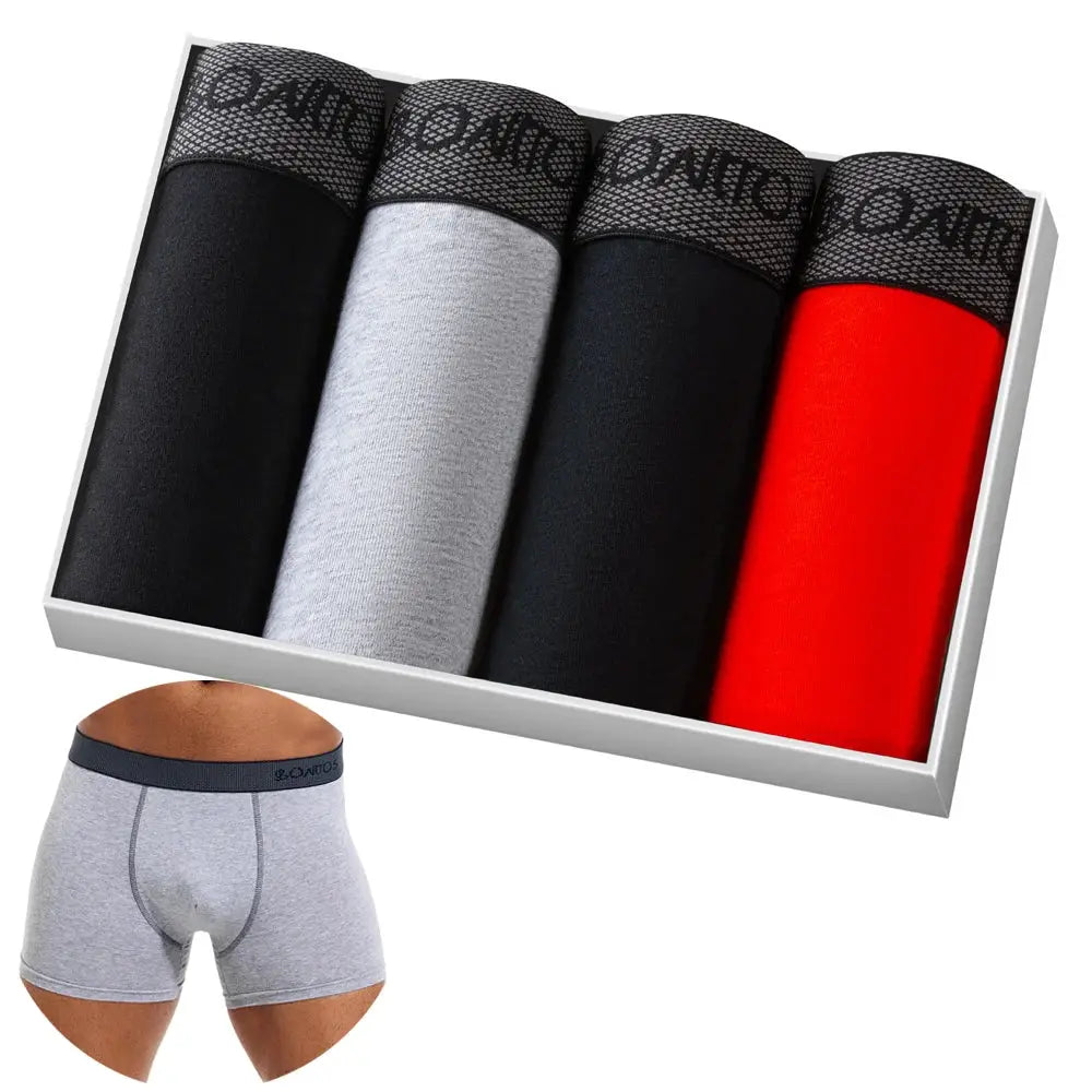 Simples Market 4-pack cotton men's boxer shorts in black, gray, black and red; model wearing a gray pair.