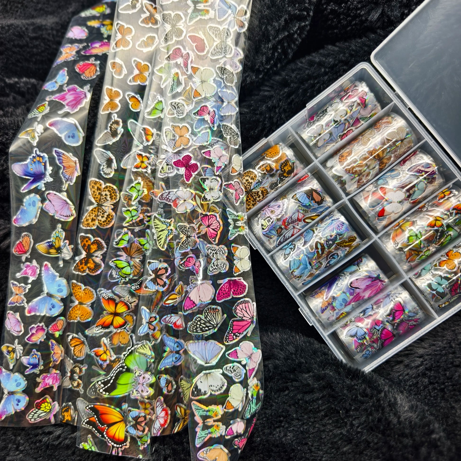 Nail art butterfly sticker sheets on clear backing; colorful assorted butterfly decals for nails and nail art projects