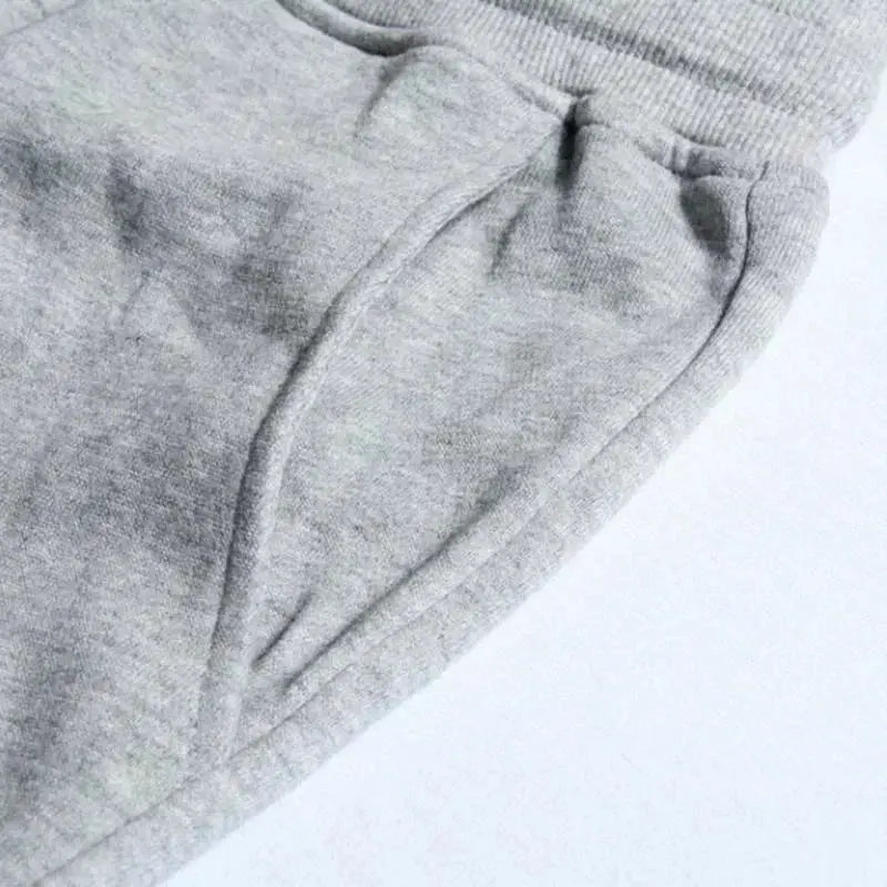 Men's gray joggers sweatpants with elastic waistband and side pockets