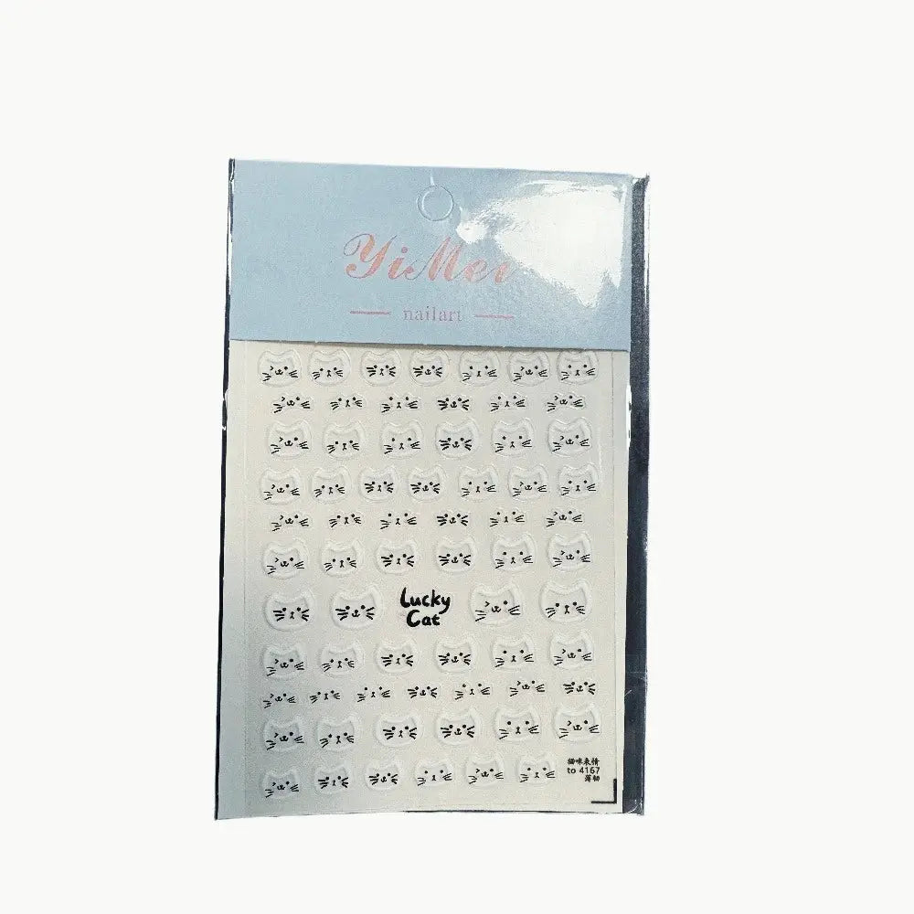 Cat face nail art stickers sheet with repeating white kitten faces on clear backing for manicures