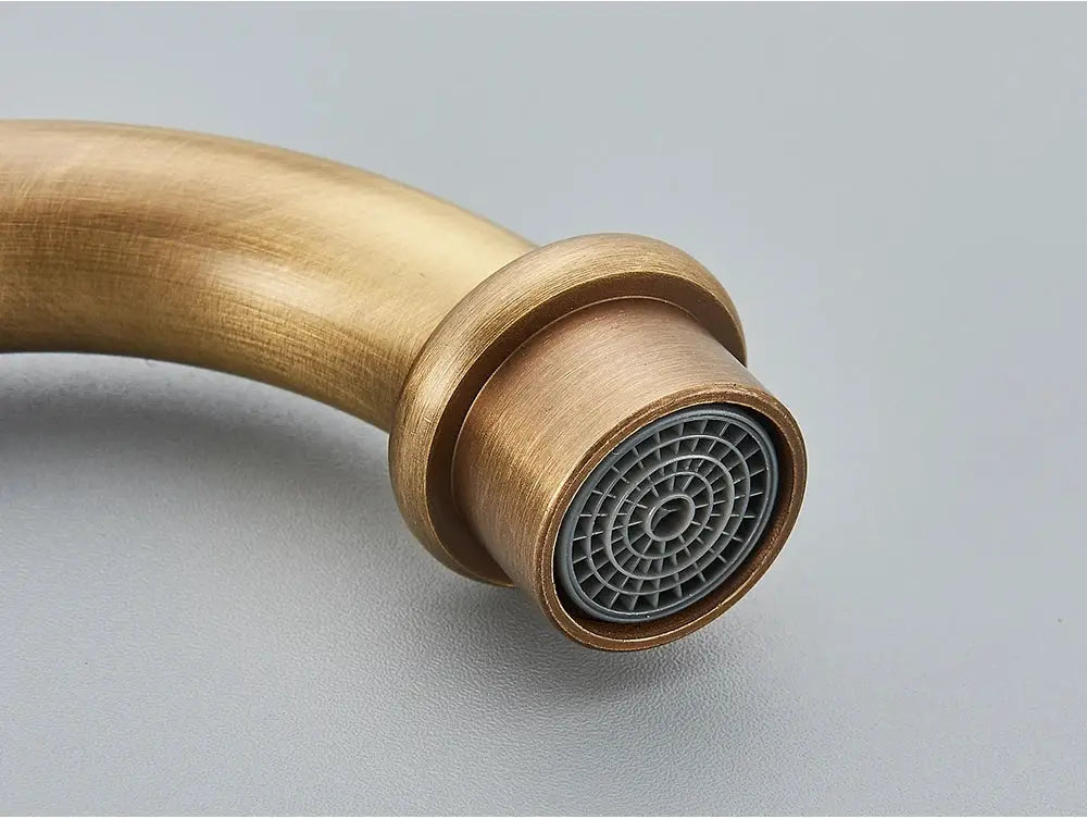 Antique brass bathroom faucet from Simples Market with rotating spout and grey aerator