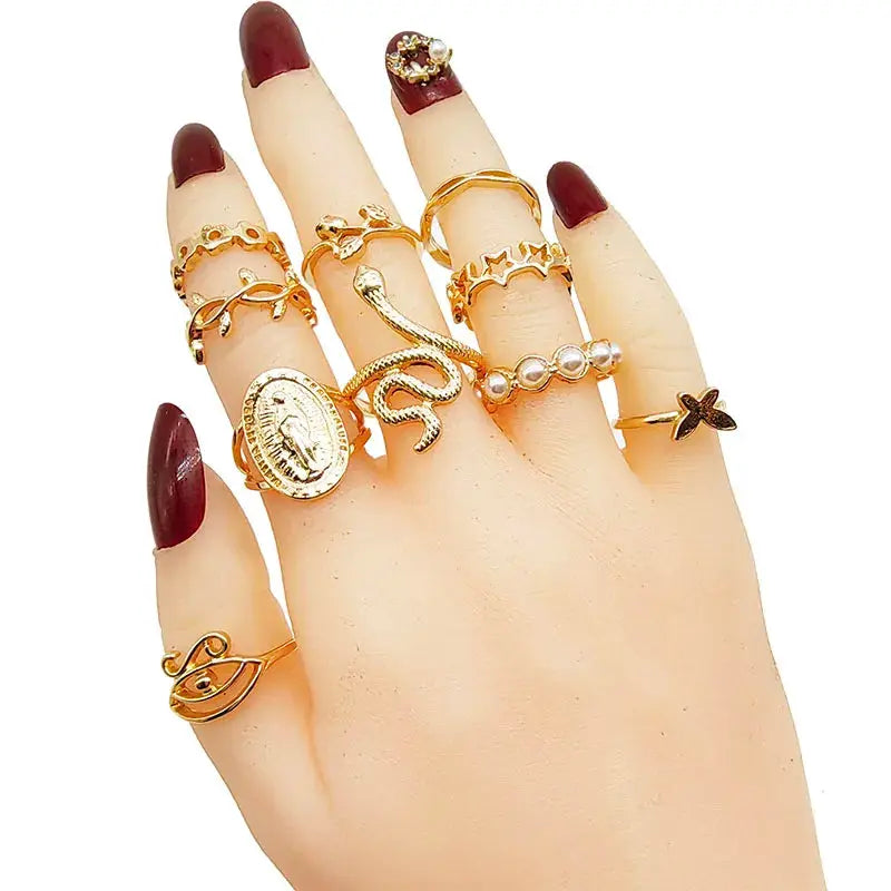 30-piece gold-tone finger ring set for women featuring butterfly, pearl, star and snake designs by Simples Market