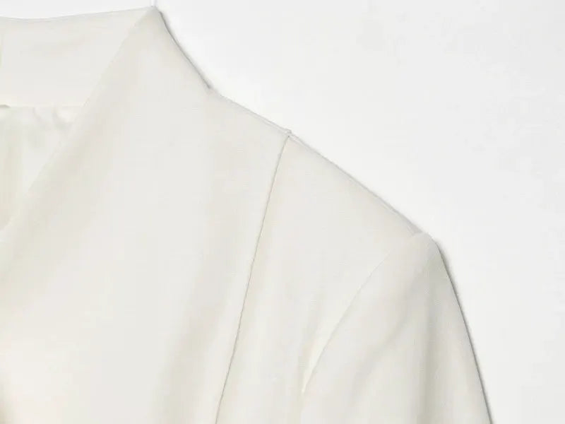 Slim-fit white blazer for women with structured shoulder