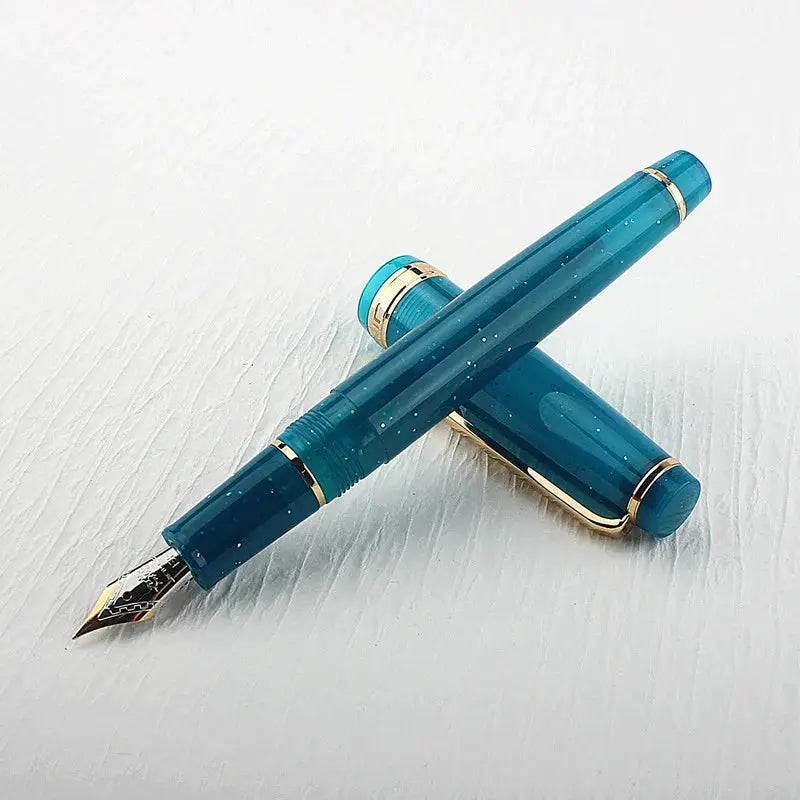 Jinhao 82 fountain pen in teal acrylic with gold trim and converter