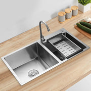 Stainless steel double-bowl drop-in kitchen sink with noise-reducing design, draining rack and modern faucet