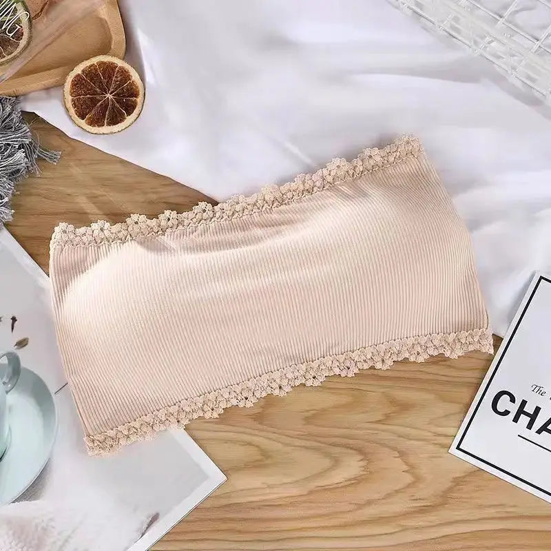 Beige strapless bra with lace trim and ribbed seamless fabric