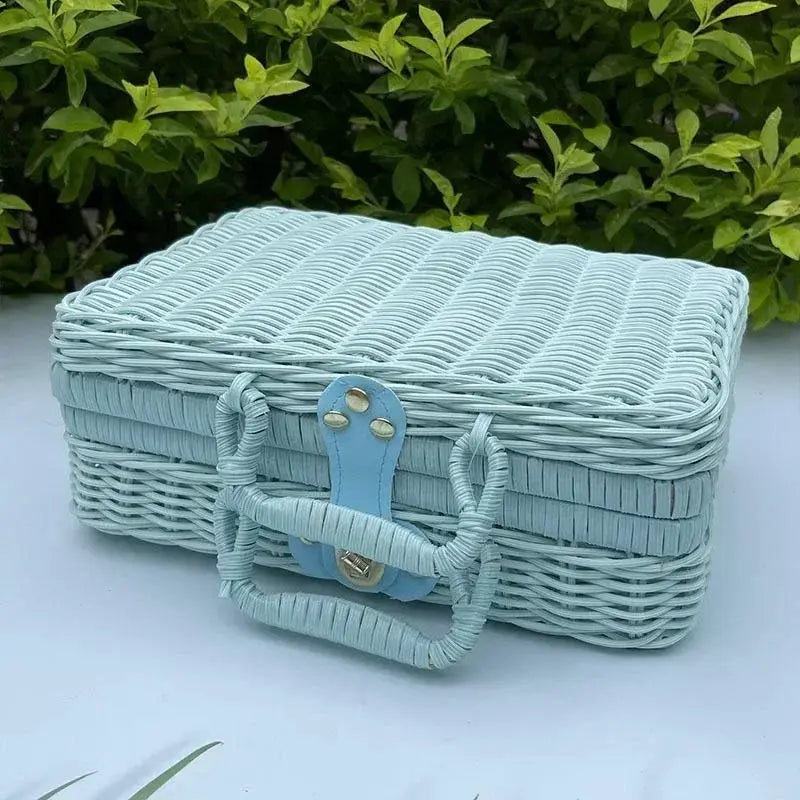 Rattan-like storage box in blue with lid and handles, decorative gift box.