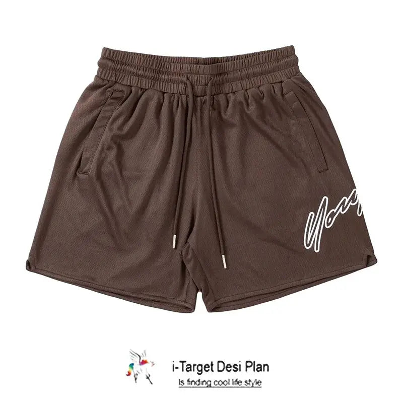 Trend men's brown mesh shorts with quick-dry fabric, elastic waist, side pockets, and a white script logo on the leg
