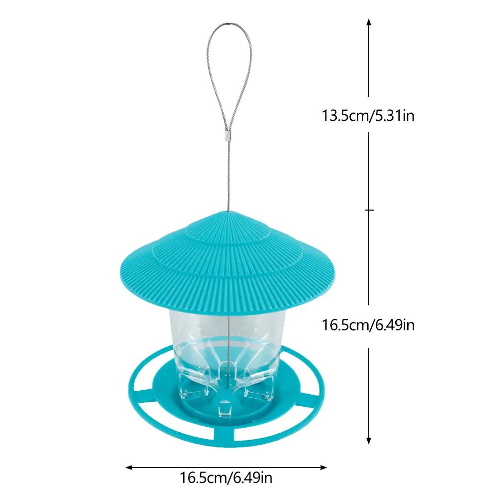 Bird feeder in turquoise plastic with ribbed conical roof, clear seed container, hanging loop.