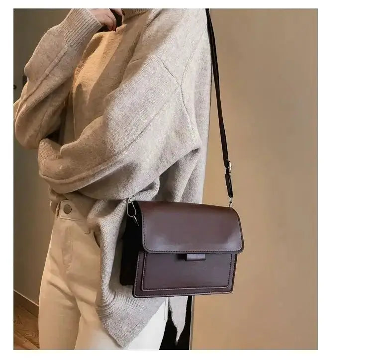 Classic designer PU leather crossbody bag in brown with front flap and adjustable shoulder strap