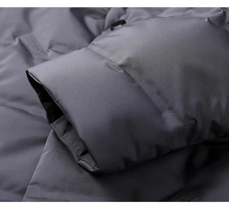 Men's gray down jacket by Simples Market; padded puffer coat sleeve cuff close-up