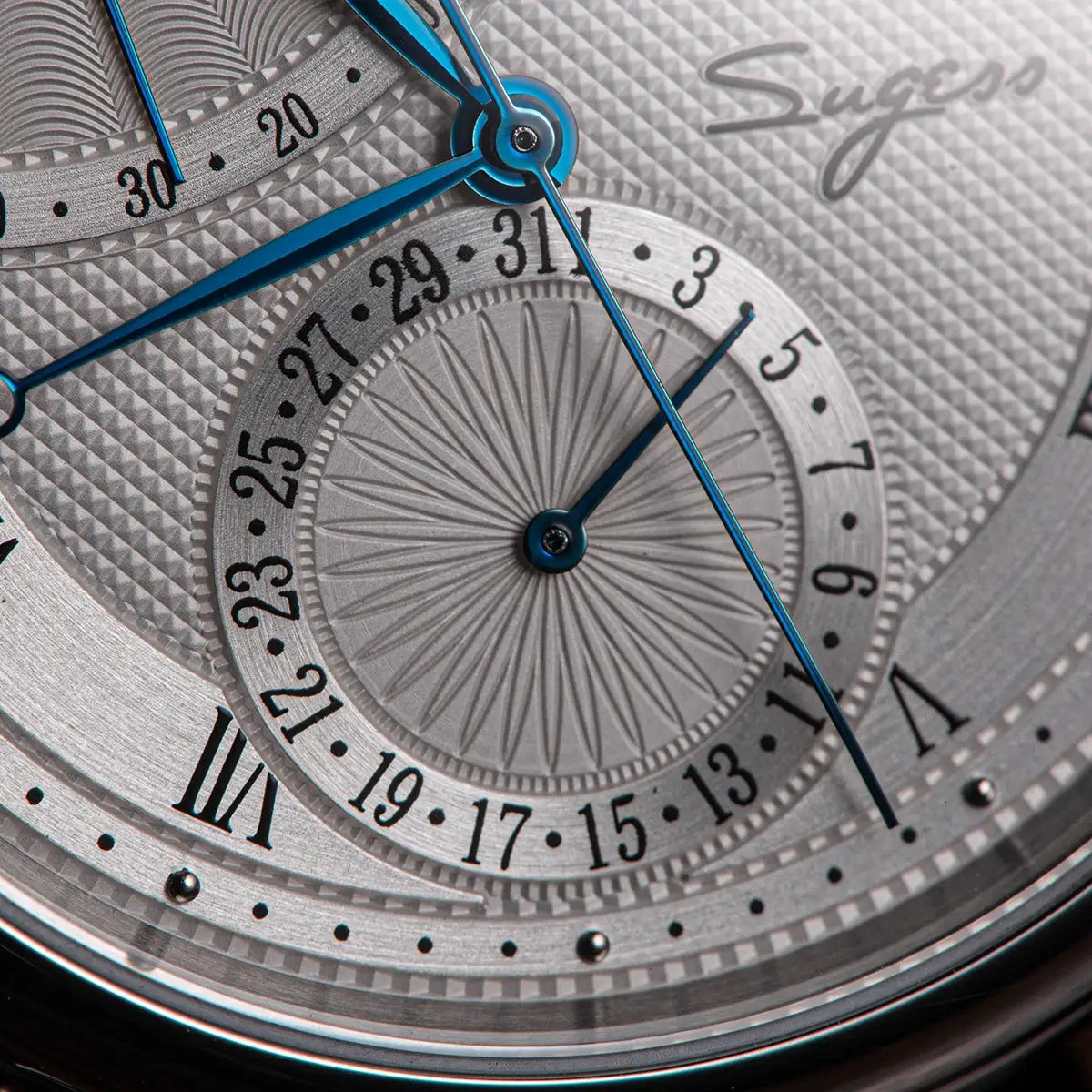 Sugess Moonphase men's watch with blue hands on a textured silver dial and date ring
