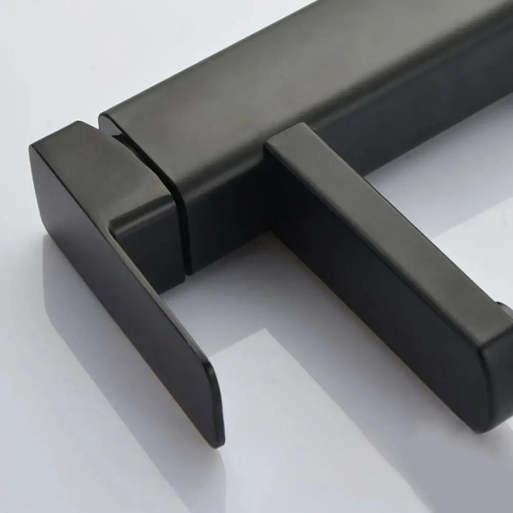 Deck-mounted bathroom faucet in black with dual handles
