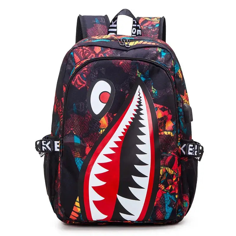 Backpack by Simples Market with bold cartoon shark print and multicolor pattern for elementary school.