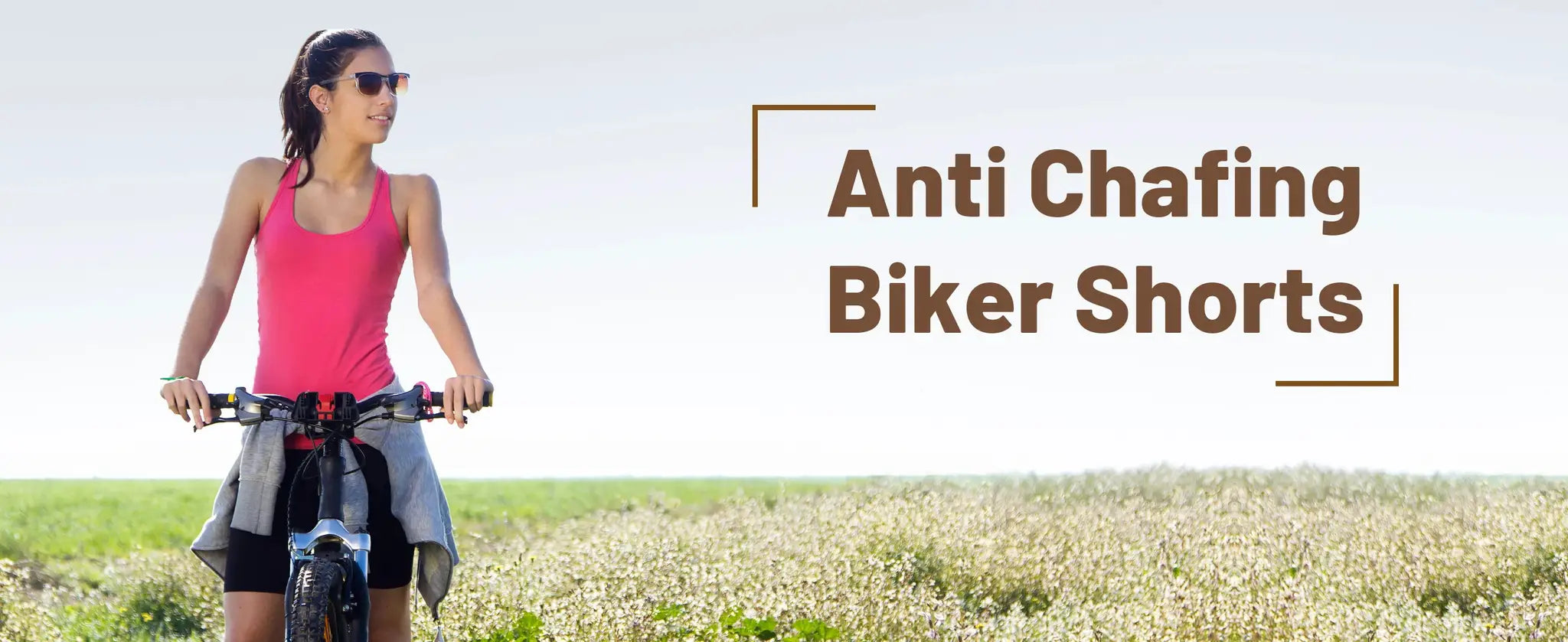 Anti Chafing Biker Shorts banner featuring a woman biking outdoors in a pink tank top