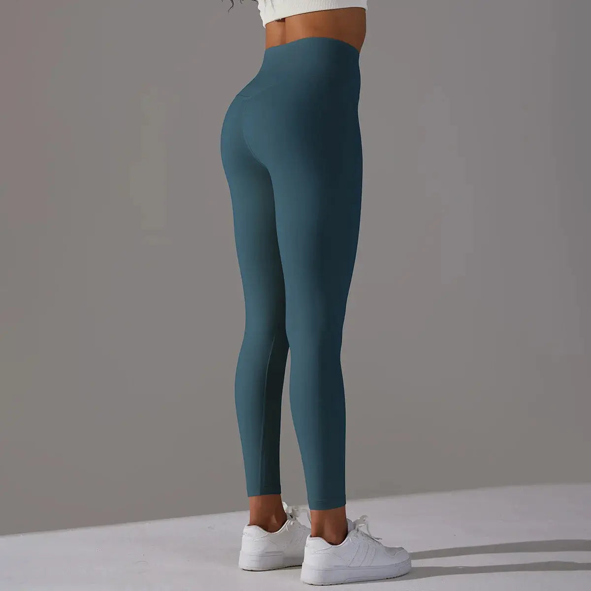 High Waist Naked Feeling leggings by Simples Market in teal for women's fitness and yoga.