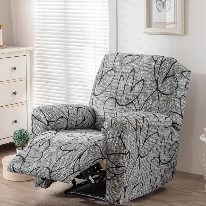 Stretch recliner chair cover in grey fabric with black abstract pattern.