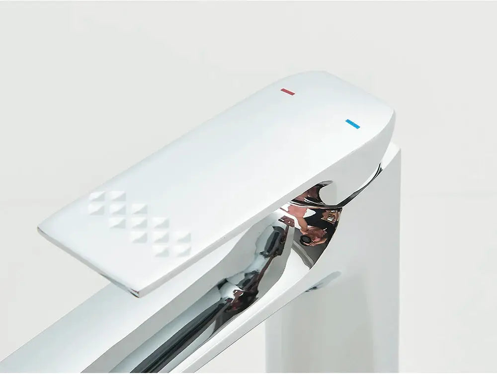 Deck-mounted bathroom faucet with white lever and chrome finish; single-lever control