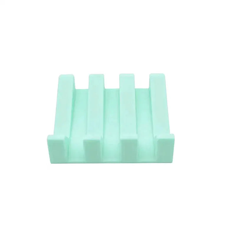 Simples Market mint green silicone soap dish rack with tilt drainage slots.