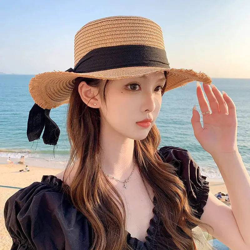 Korean bow straw hat for women, wide-brim beach sun visor in natural straw with black ribbon