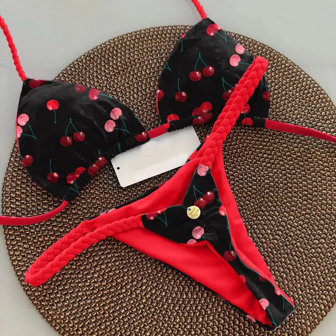 Simples Market women's two-piece cherry-print bikini set; black top with red cherries and red braided straps.