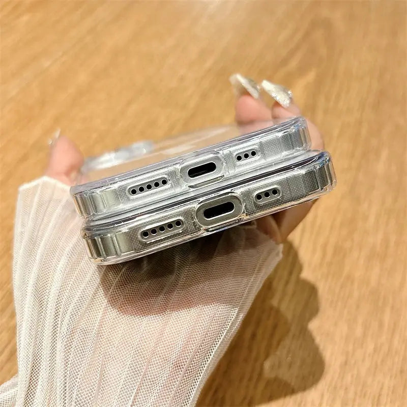 Pair of clear MagSafe iPhone cases with transparent shells and port cutouts