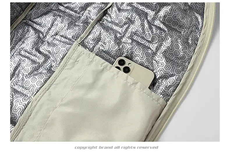 Simples Market winter white down jacket with beige interior and inner pocket holding smartphone