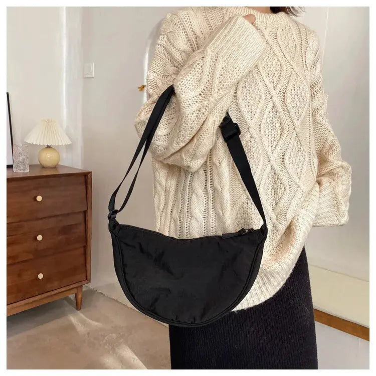 Crossbody bag by Simples Market, black nylon padded purse with adjustable strap.