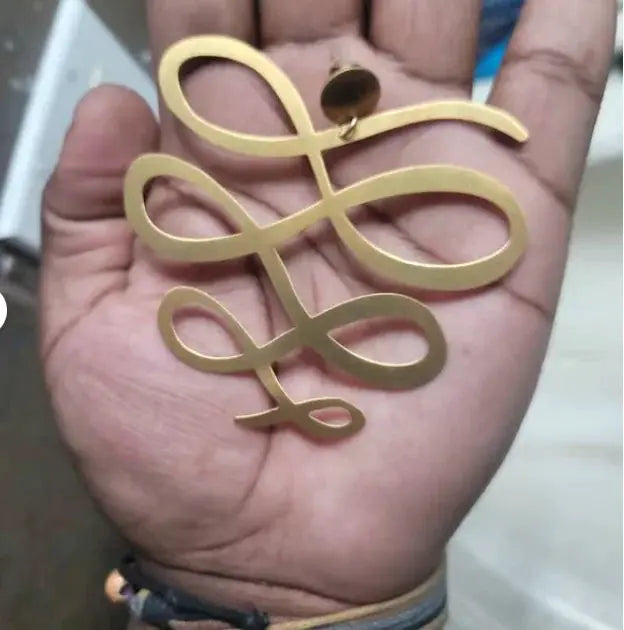 Large squiggle dangle earrings, gold-tone metal, one pair.