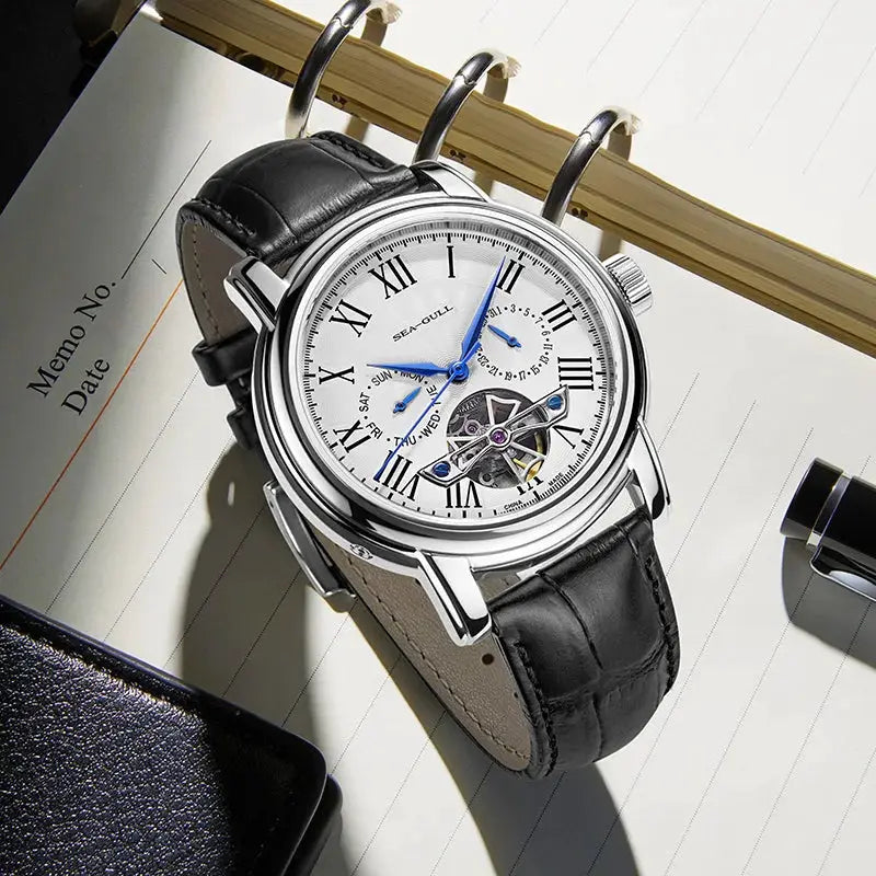 Men's automatic wristwatch with Seagull ST25 movement, white dial, Roman numerals, blue hands, black leather strap