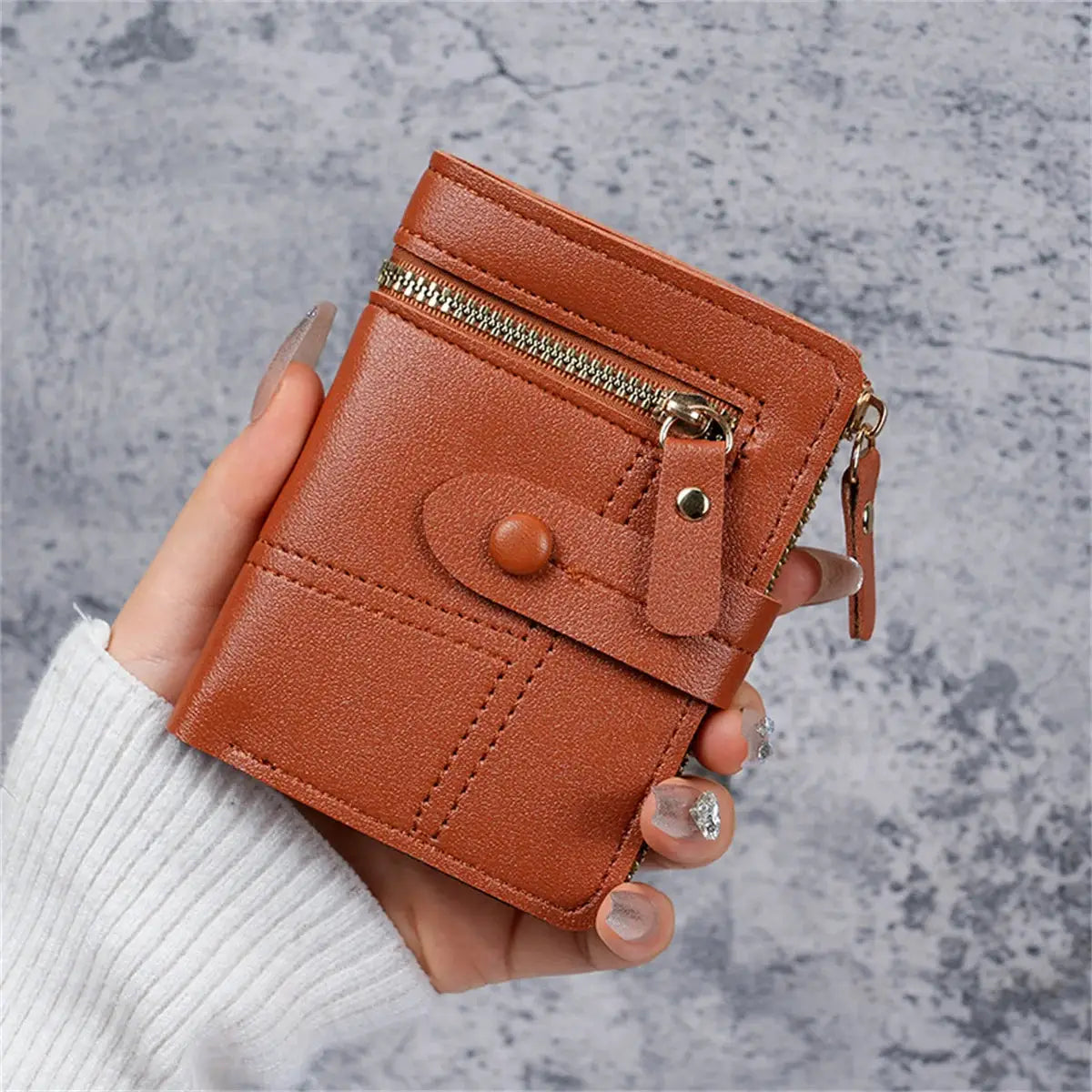 Tan faux leather wallet for women, compact with zip pocket, card clip, and button strap
