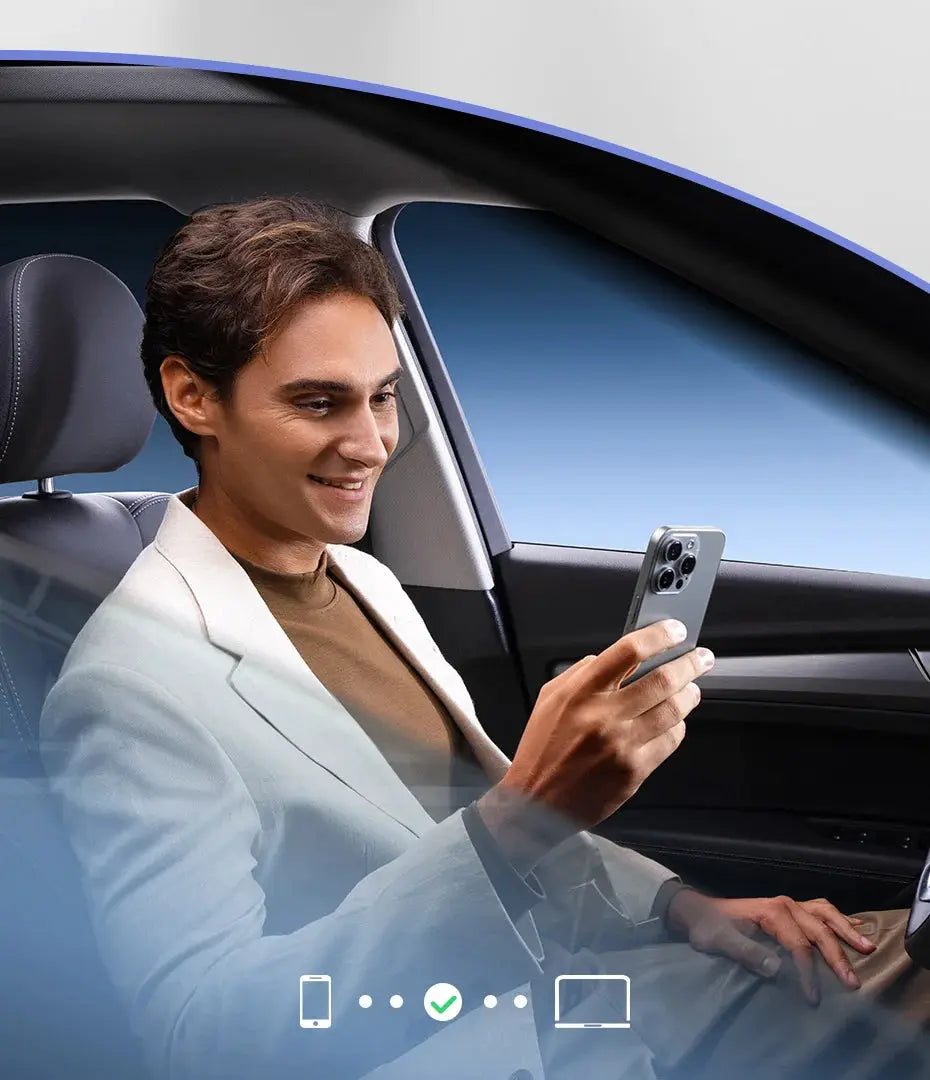 Baseus wireless CarPlay adapter in car; man uses smartphone