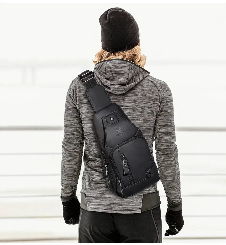 HUMERPAUL men's USB chest bag in black genuine leather with multiple zip pockets worn crossbody