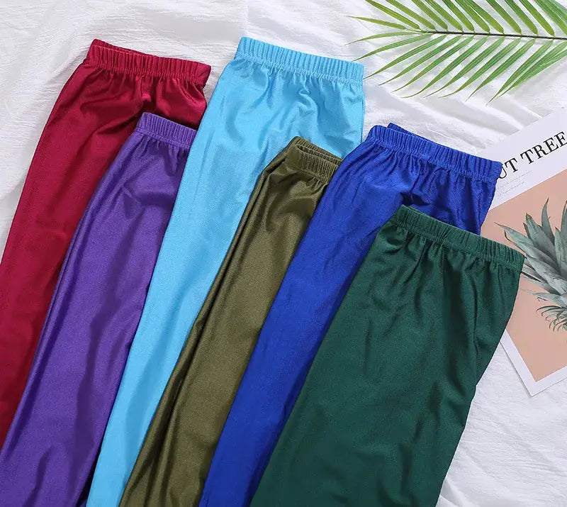 High-elastic skinny leggings by Simples Market in assorted shiny colors