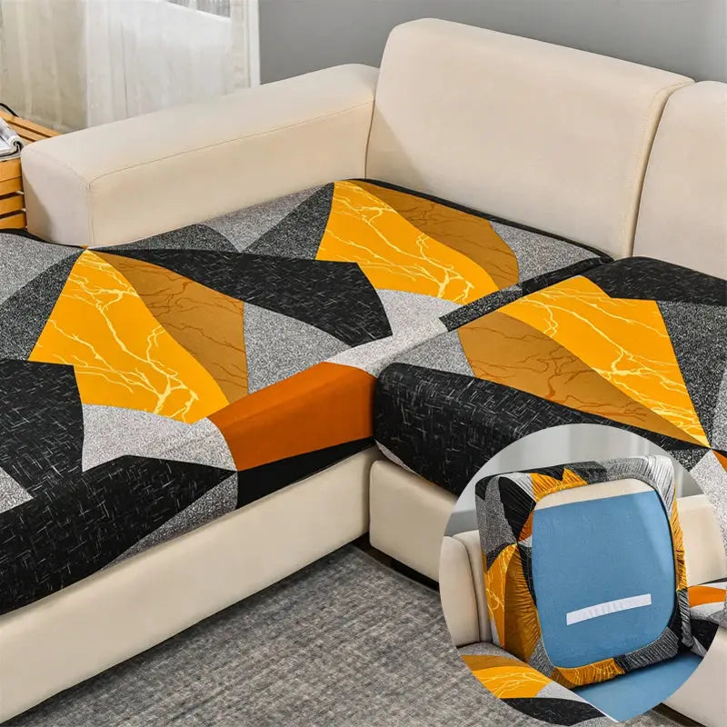Stretch couch cushion slipcover with geometric orange, black and gray pattern; anti-slip sofa cushion protector.