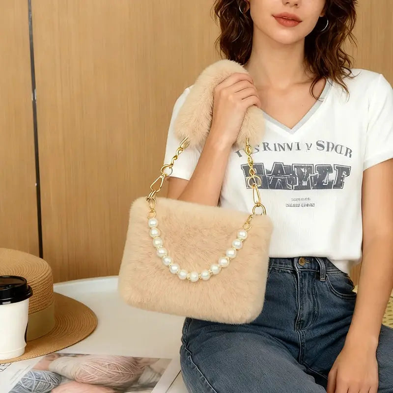 Beige rabbit fur handbag with pearl bead chain and gold-tone crossbody strap