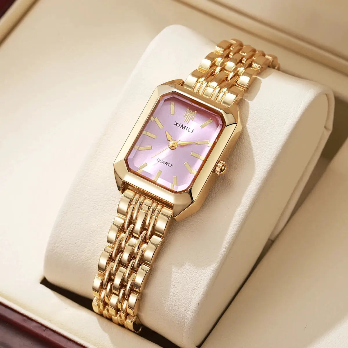 Luxury women's rectangle quartz watch with gold-tone steel band and pink dial