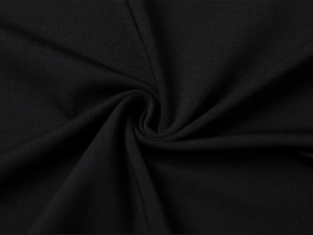 Black compression shirt fabric close-up for athletic set