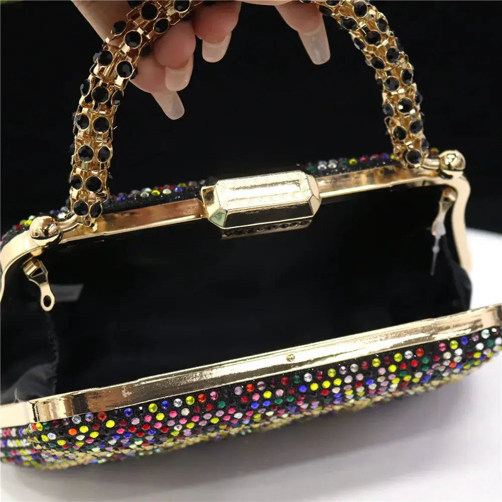 Rhinestone-embellished evening clutch with multicolor stones and gold-tone frame with ornate chain handle.