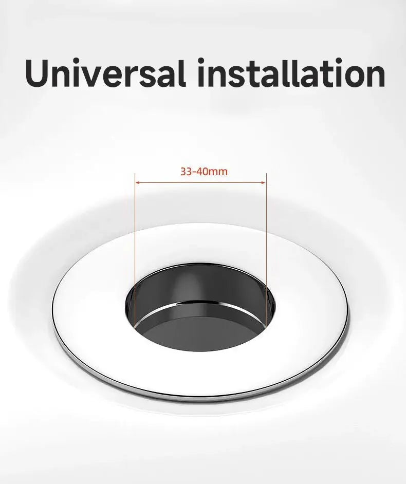 Simples Market universal basin pop-up drain filter with white outer ring and black inner plug, fits 33–40mm