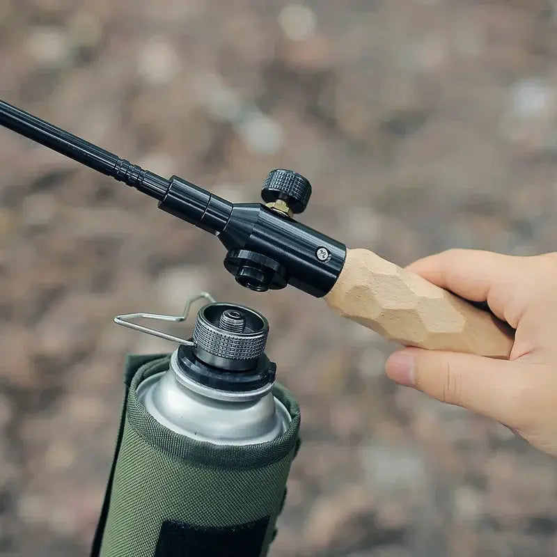 Butane adapter by Simples Market with wooden handle and black metal nozzle for camping stove use
