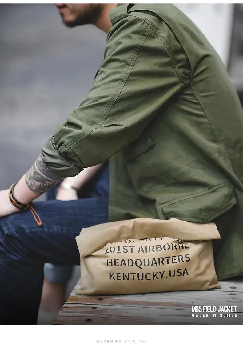 Maden M65 field jacket in olive green; military-style windbreaker with pockets and rolled sleeves
